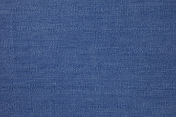 Fototapeta na wymiar Blue jeans fabric background texture. Blue jeans fabric cloth textile material.