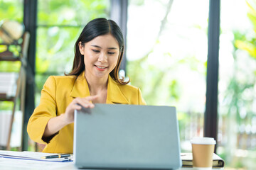 Business women image of hands close and open a laptop computer on table after finished using it