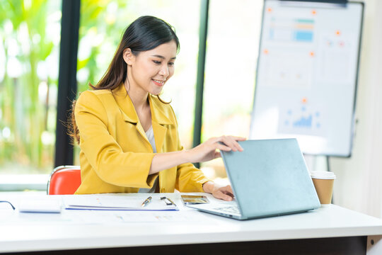 Business women image of hands close and open a laptop computer on table after finished using it