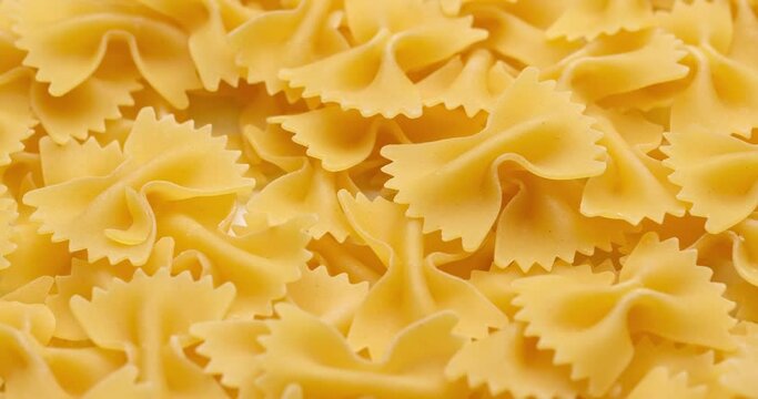pasta backgroud - macro view of Dry Authentic Italian farfalle