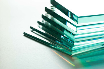 Glass factory produces clear glass of various thicknesses. a mirror on a white background