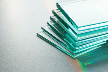 Glass factory produces clear glass of various thicknesses. a mirror on a white background
