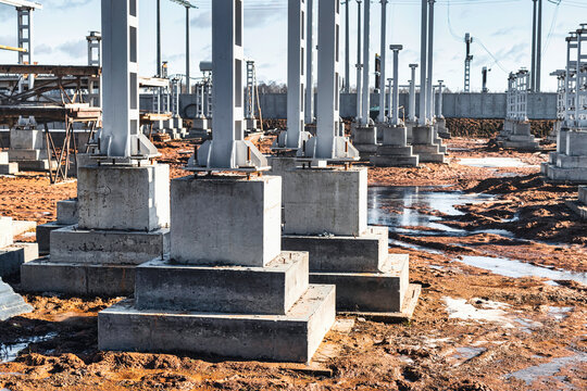 Monolithic reinforced concrete foundation or grillage for the construction of a modern power plant. Powerful columns and grillages at the construction site. Reinforced concrete monolithic structures.