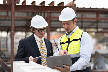Portrait caucasian engineer man working with team engineer at precast site work	