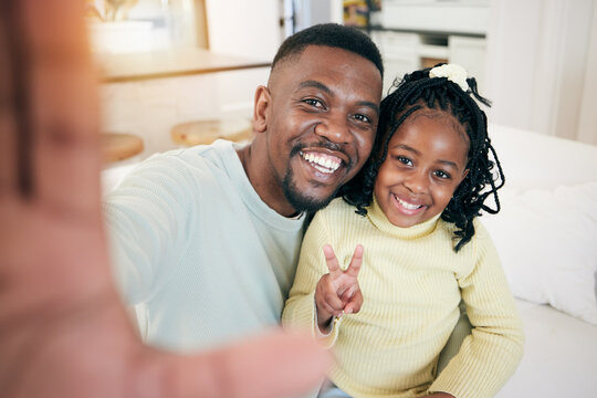 Happy, selfie and portrait of a father with his child relaxing, resting and bonding on the sofa together. Happiness, smile and African dad taking a picture with girl kid while sitting in living room.