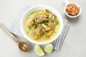 Empal Gentong Cirebon, traditional beef soup with coconut milk. Indonesian food
