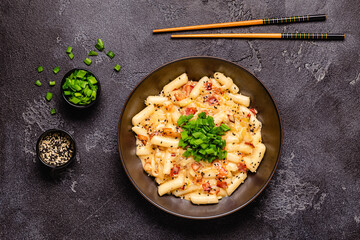 Spicy Rice Cake with Cheese and Bacon or Cream Teokbokki, Tteokbokki.