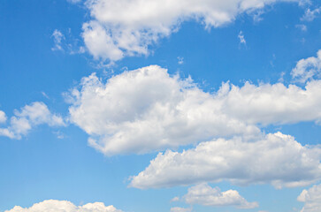 White clouds in a bright blue sky. The beauty of the nature