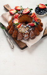 Pound Cake cake with strawberry, close-up on the table. Horizontal view from above..Pound Cake cake with mint and strawberry close-up on the table. Horizontal view from above.