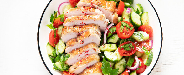 Salad with chicken meat. Fresh vegetable salad with chicken breast. Meat salad with chicken fillet and fresh vegetables on plate.