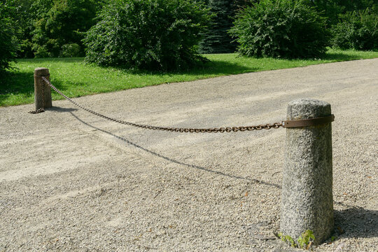 Stone barrier with big chain.