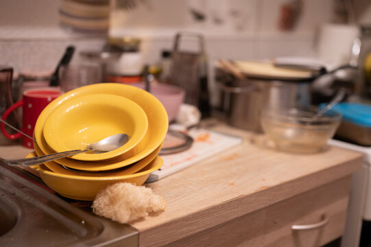 Huge heap of dirty dishes waiting for the flatmate in the kitchen