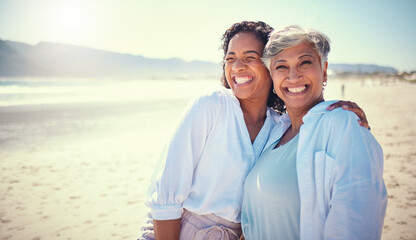 Mother with her adult daughter at the beach while on a vacation, weekend trip or summer getaway....