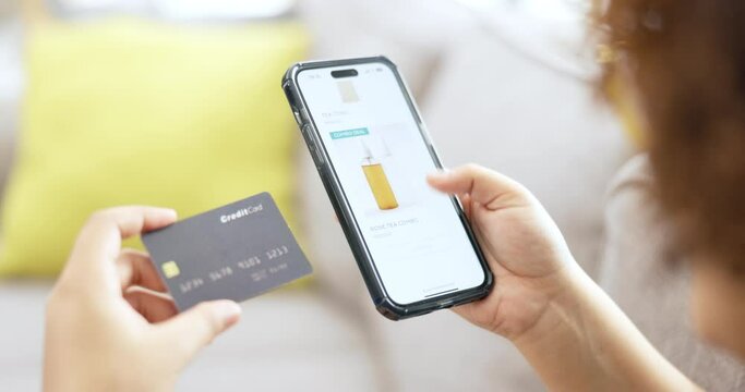 Hands, smartphone and credit card for online shopping, girl and makeup choice on web store in lounge. Black woman, phone and e commerce ux for cosmetics, retail product or payment in home living room