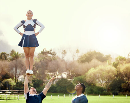 Cheerleader, people on team outdoor and athlete group with fitness, uniform and cheerleading routine with balance. Exercise, competition and cheers, collaboration and happy with sport event on campus