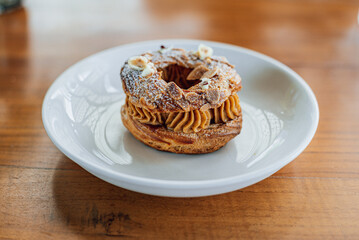 French pastry Paris Brest on a white plate