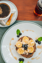 Healthy Breakfast Pancake oatmeal topped with bananas and Erable syrup