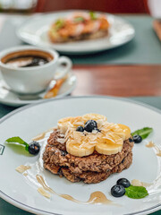 Banana pancake on a white plate