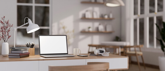 Close-up home workspace with laptop mockup on table in minimal cozy living room