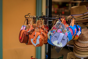 Cute felt animal themed bags at a souvenir shop in Nice, France