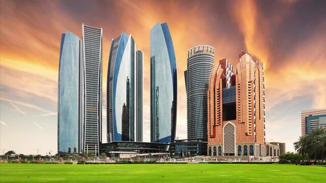 Time lapse of Skyscrapers in Abu Dhabi at dramatic sunset; United Arab Emirates