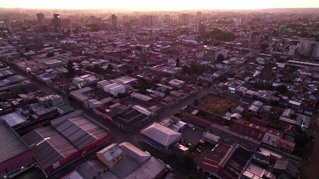 Aerial view establishing Temuco, Chile. Sunset in the background, residential area