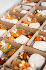 In Indonesian it is called Rice Box or Nasi kotak with perkedel kentang. Usually distributed during celebrations or catering packaging.