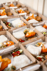 In Indonesian it is called Rice Box or Nasi kotak with perkedel kentang. Usually distributed during celebrations or catering packaging.