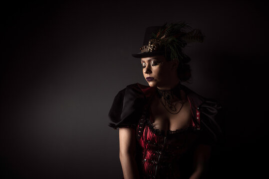 Emotional Portrait of Young Woman in Steampunk or Retro style.