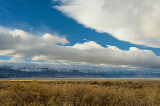 Puffy Clouds Rolling Over The Oregon Desert