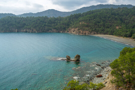 the scenic route of lycian trail, between Tekirova and &Ccedil;ıralı is full of amazing bays and beaches with forest and mountains.