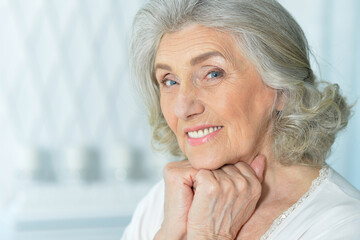 close up portrait of beautiful smiling senior woman