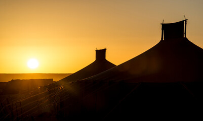 Silhouette of jaimas in the sahara desert.