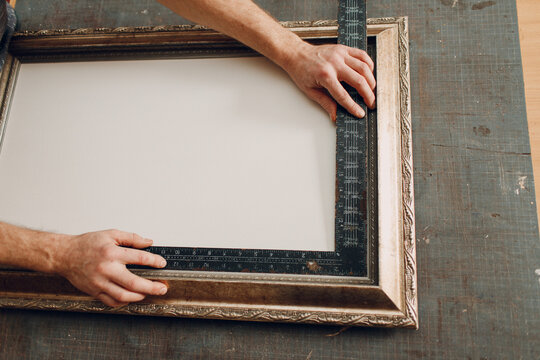 Framing Workshop. Measure ruler frame baguette handmade picture frame at studio table