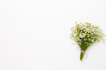 Chamomile flowers floral framee. Flat lay, top view.