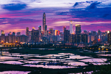 Shenzhen City Skyline during Magic Hour at Dawn after Sunset, View from Hong Kong SAR, China