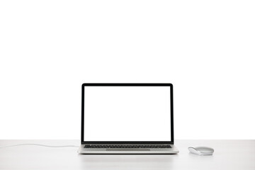 Modern laptop on office table with mouse with blank screen.PNG image