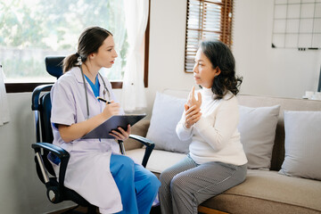 medical doctor holing patient's hands and comforting her.Kind doctor giving real support for patient. In home