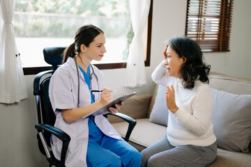 Obraz premium medical doctor holing patient's hands and comforting her.Kind doctor giving real support for patient. In home