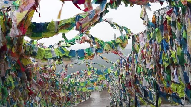 Flags of good luck,buddhist prayer flags with mantras on special metal structures, fluttering in wind. Buddhist datsan Rinpoche Bagsha on mount Lysaya, Ulan-Ude, Buryatia, Russia