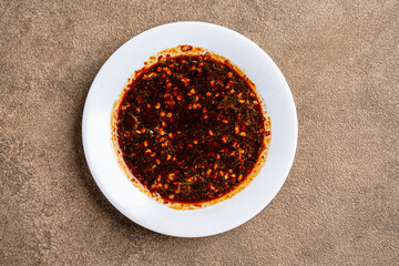 Sambal kecap is Indonesian traditional chili sauce made from soy sauce mixed with chunks of cayenne pepper.