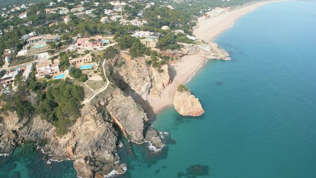 Aerial views of the beach of Pals in the province of Girona on the Costa Brava paradisiacal beach transparent crystal clear water