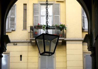 Old wall street lighting, in the old town, Milan, Italy