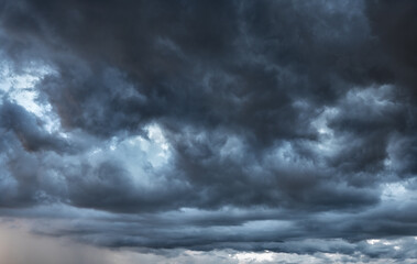dark clouds make sky in black. Heavy rain thunderstorm. Pattern of clouds overcast predict tornado,...