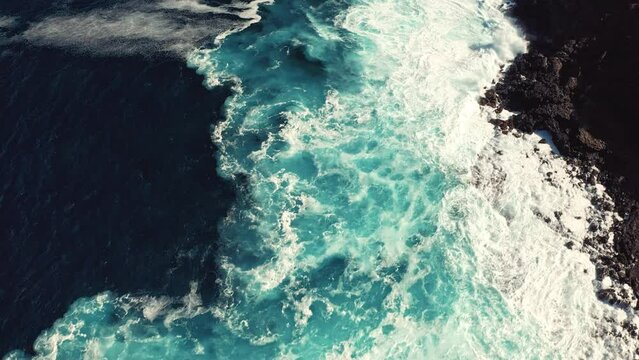 Drone shot of the wild coast of Lanzarote. Waves crashing on the wild coast of Lanzarote Spain.