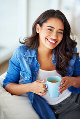 Its the only way to start the day. a young woman drinking coffee while relaxing at home.