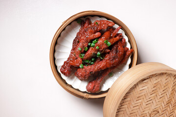 Chinese Dimsum, Steamed Chicken Feet in Bamboo Steamer.