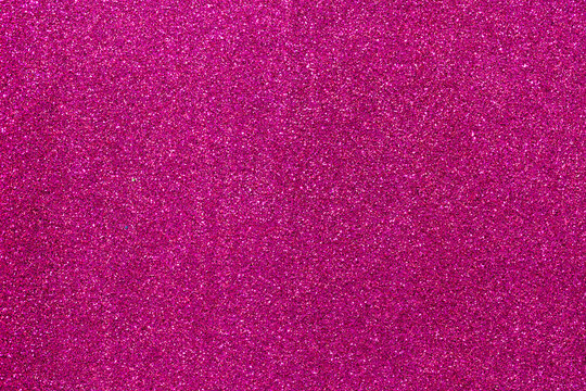 Abstract background filled with shiny fuchsia glitter