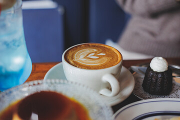 Artistic latte artwork in a cafe