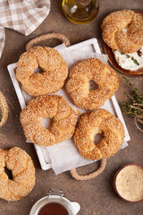 Bagels with sesame seeds. Freshly baked bread buns from yeast dough. 